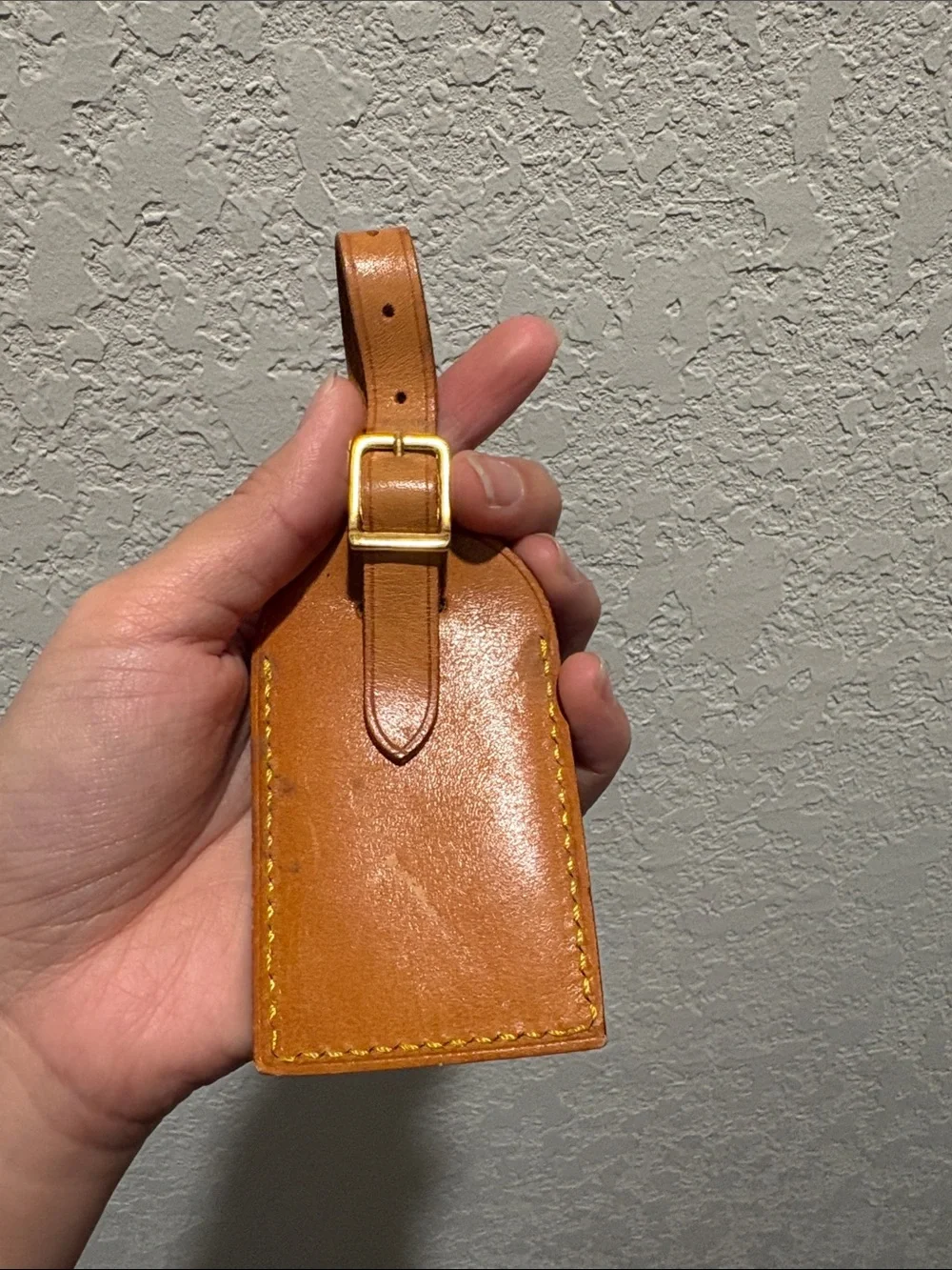Louis Vuitton leather luggage tag.